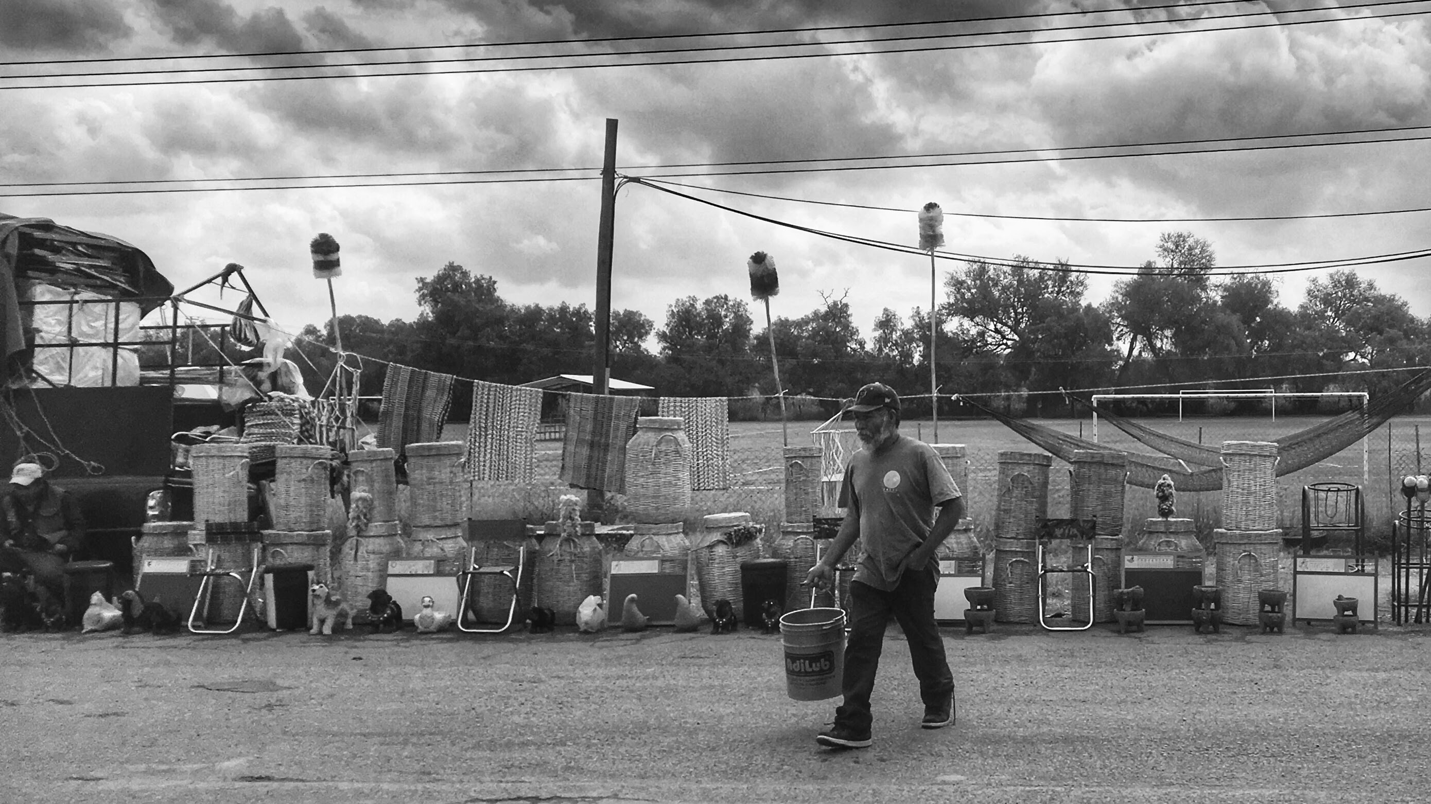 Man walking with a bucket
