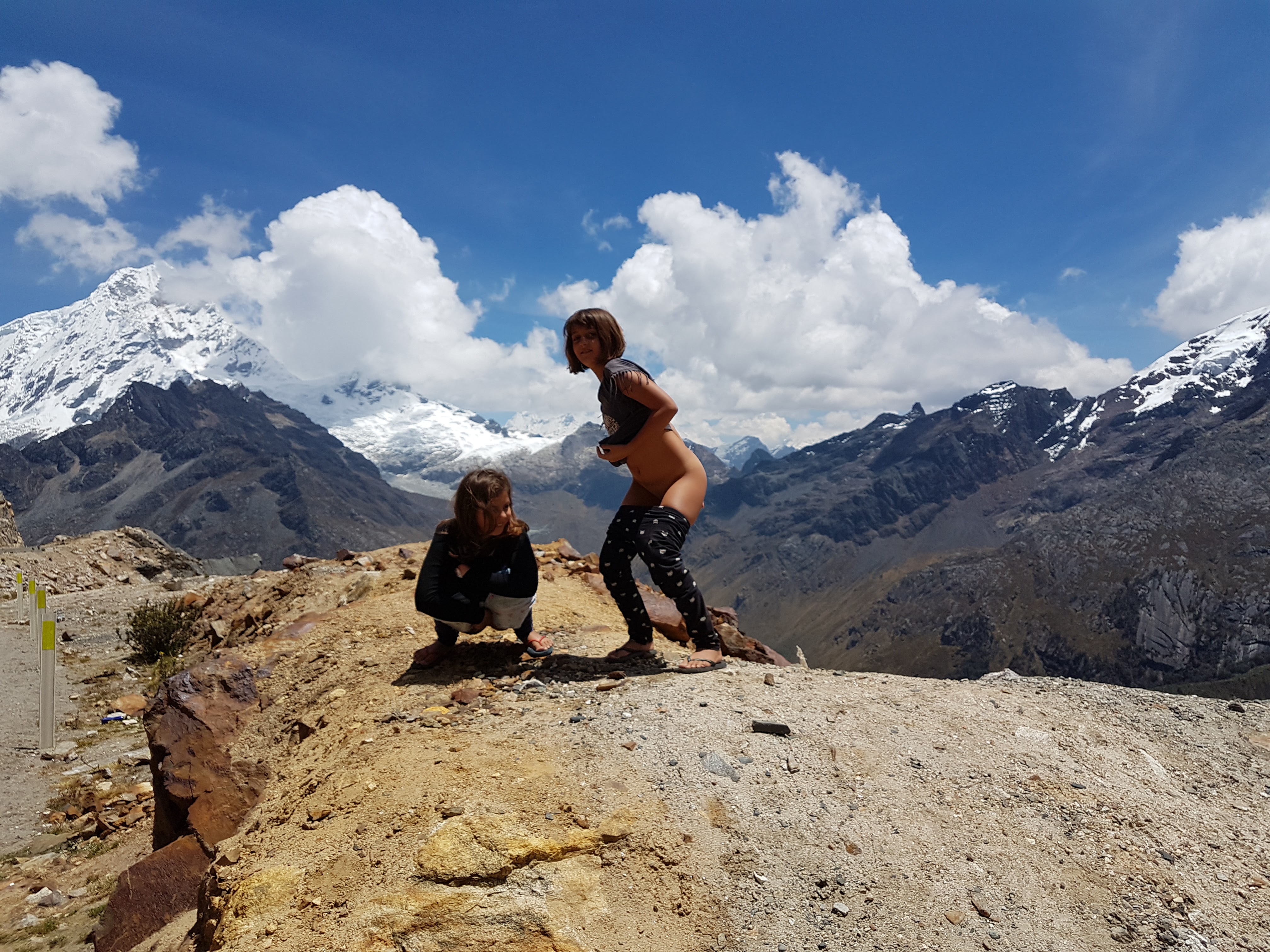 Girls peeing on a mountainside in the Andes
